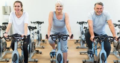 Individuals riding on Spin bikes